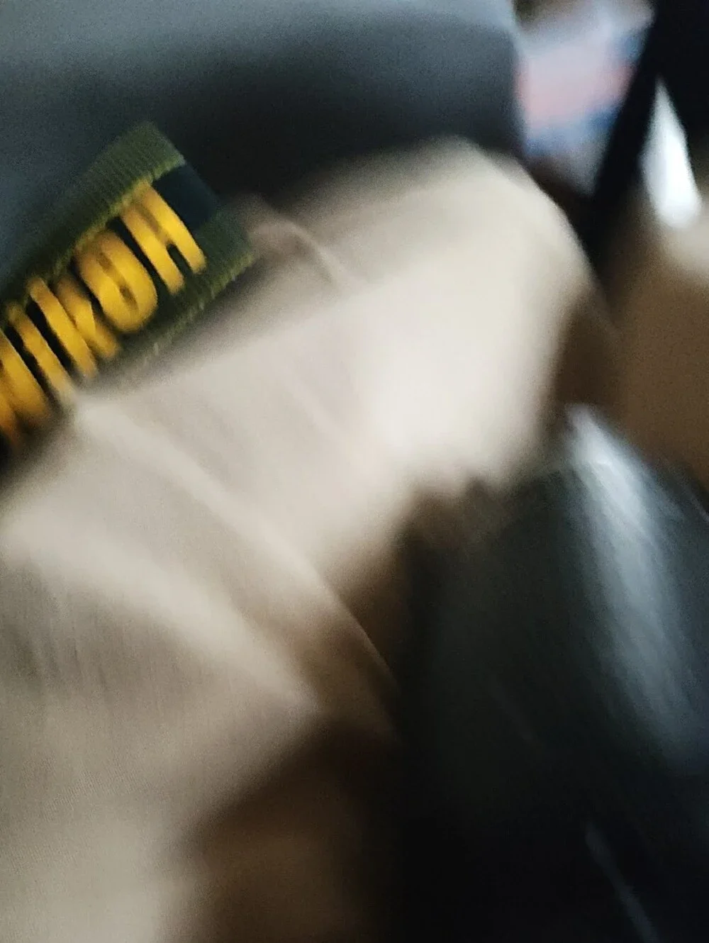 Nikon Black DSLR with Telephoto Lens and Branded Strap
